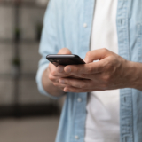 Person holding mobile phone